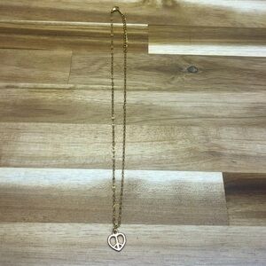 gold necklace with peace sign heart chain